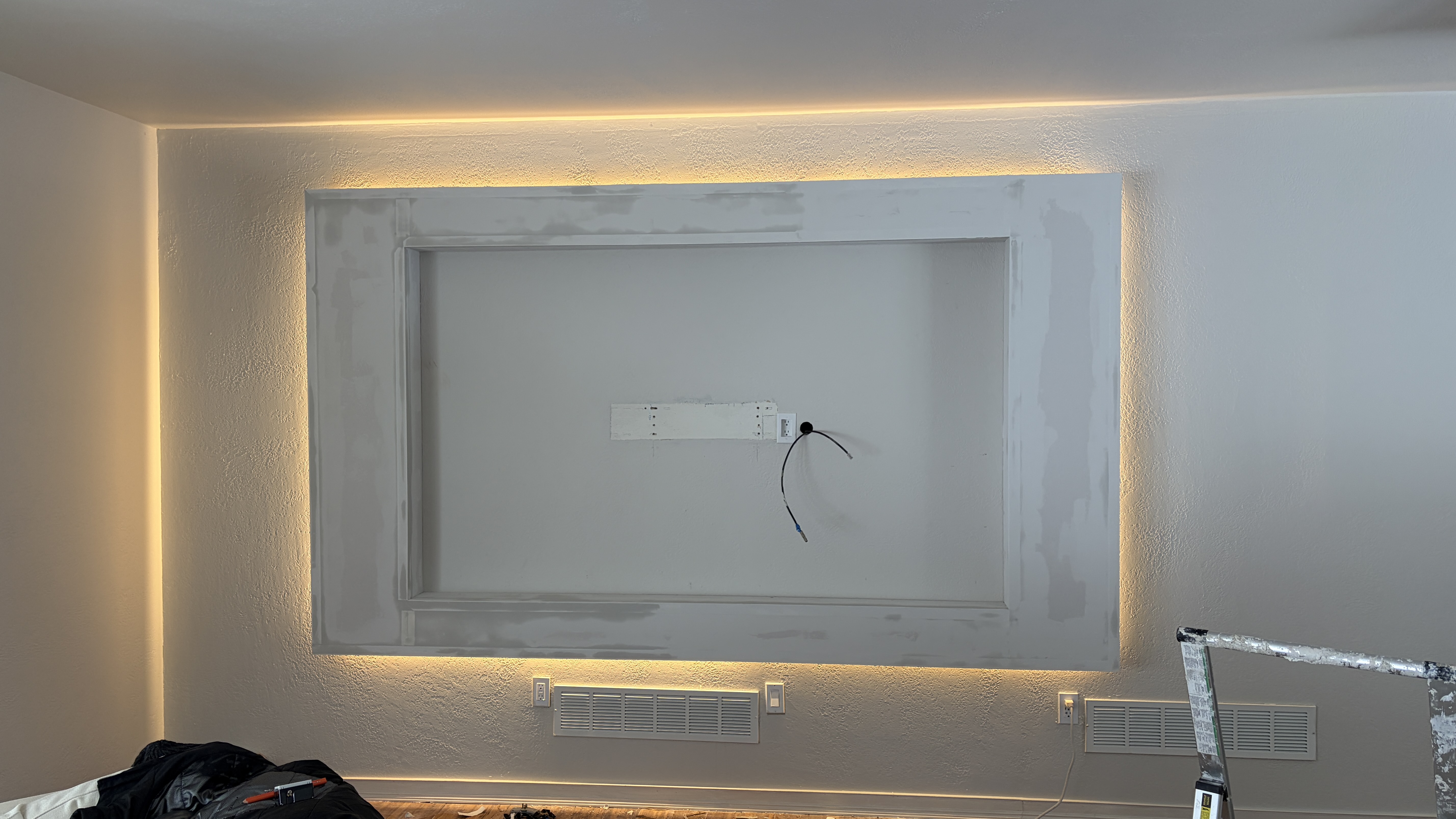 Custom Media Wall with Recessed TV & Halo Lighting