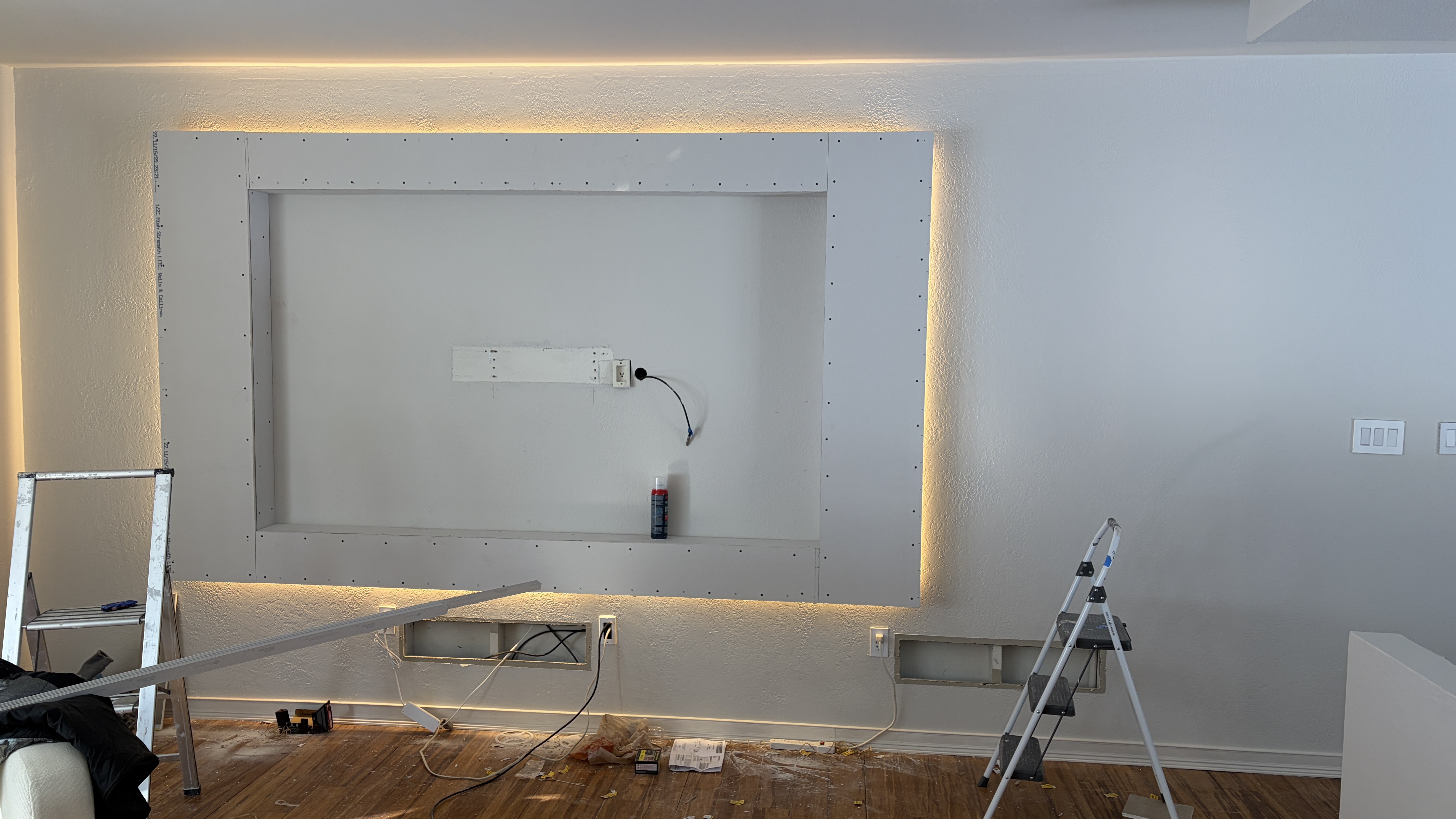 Custom Media Wall with Recessed TV & Halo Lighting