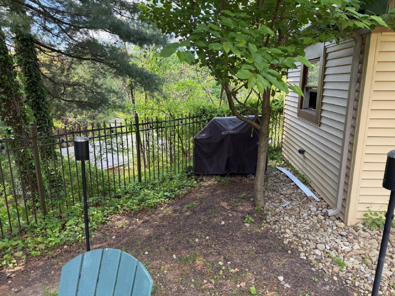 SIDE YARD PAVER PATIO TRANSFORMATION Before